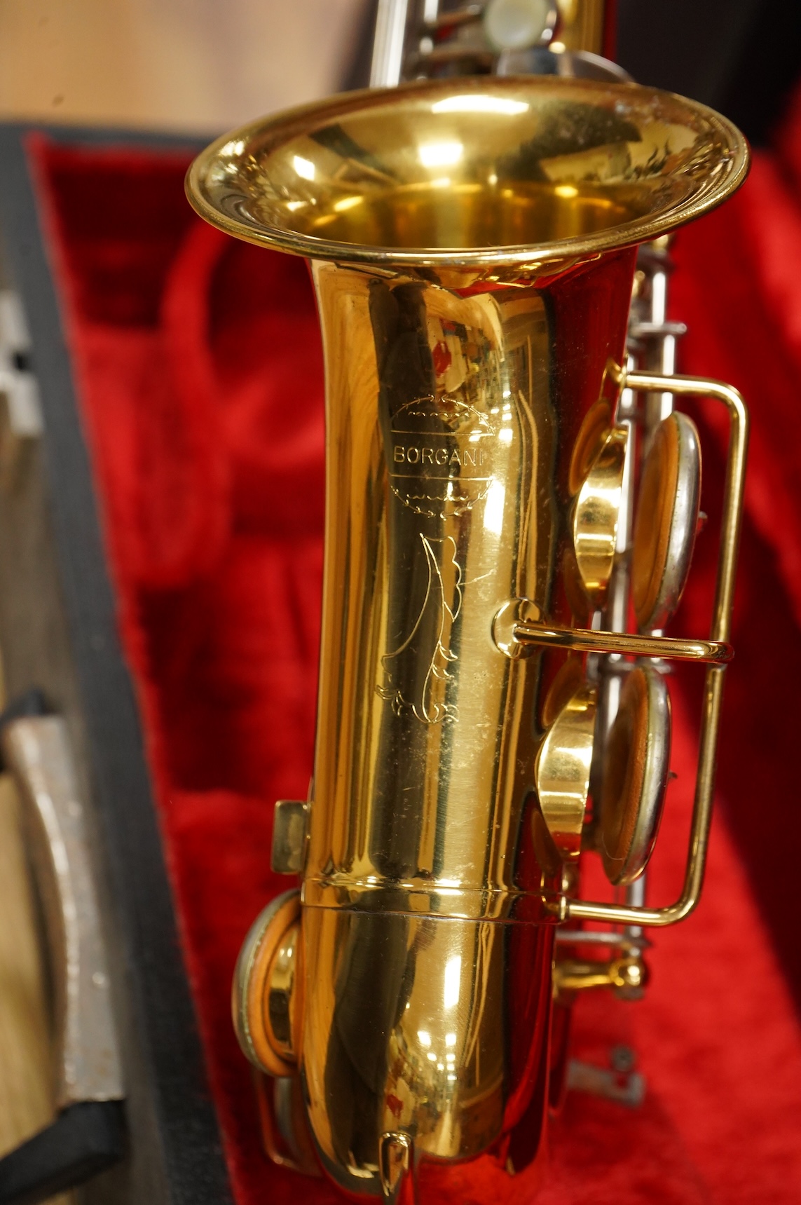 A cased Borgani soprano saxophone